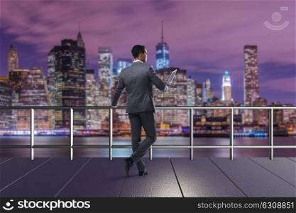 Businessman with laptop in business concept