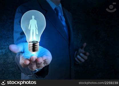 businessman with light bulb choosing people icon as human resources concept
