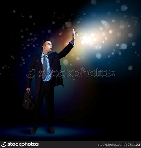 Businessman with light shining