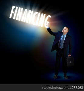 Businessman with light shining