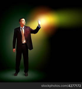 Businessman with light shining