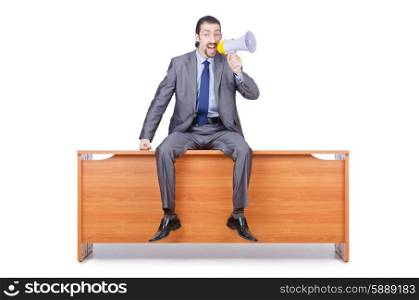 Businessman with loudspeaker at the desk