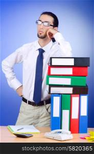 Businessman with many office folders