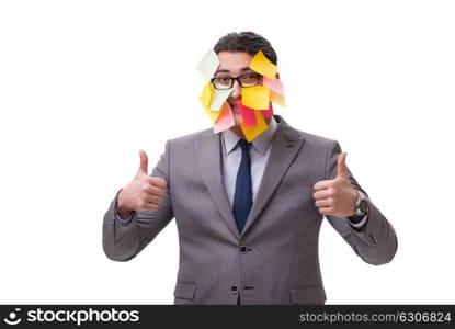 Businessman with many reminders isolated on white