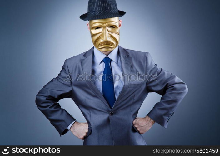 Businessman with mask concealing his identity