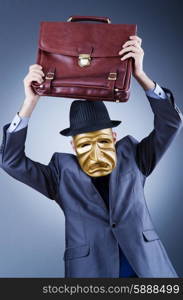 Businessman with mask concealing his identity