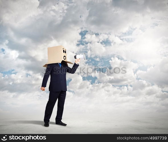 Businessman with megaphone. Businessman with box on head screaming in megaphone