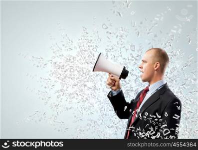 Businessman with megaphone. Image of angry businessman screaming in megaphone