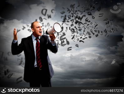 Businessman with megaphone. Image of angry businessman screaming in megaphone