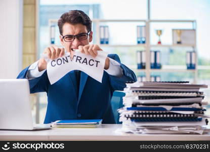 Businessman with message in the office at desk