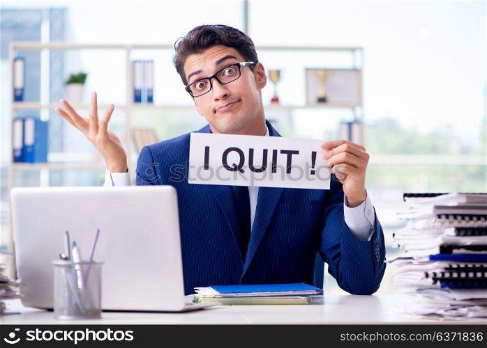 Businessman with message in the office at desk