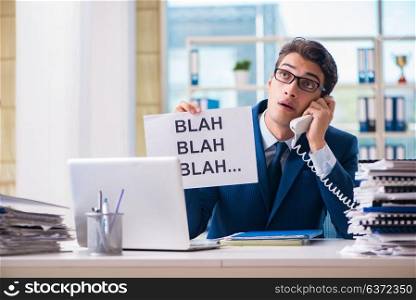 Businessman with message in the office at desk