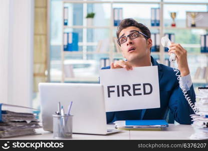 Businessman with message in the office at desk