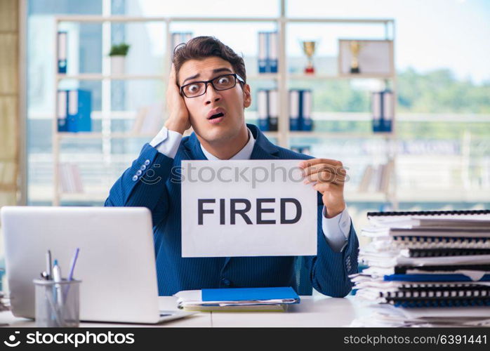 Businessman with message in the office at desk