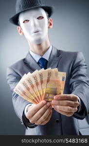 Businessman with money and mask