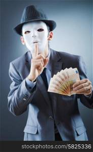 Businessman with money and mask