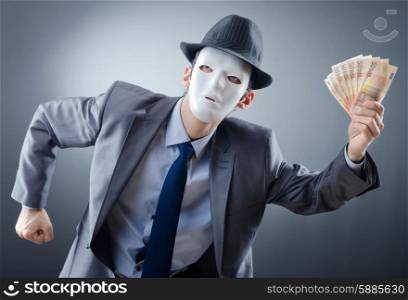 Businessman with money and mask