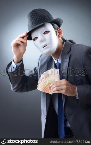 Businessman with money and mask