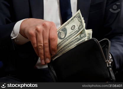 Businessman with money in hands.