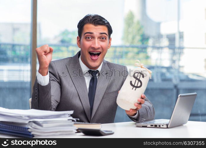 Businessman with money sack bag in office