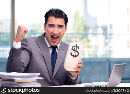 Businessman with money sack bag in office