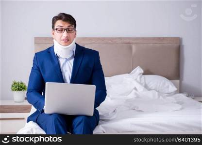 Businessman with neck injury working from home