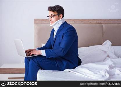 Businessman with neck injury working from home