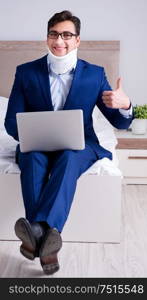 Businessman with neck injury working from home. The businessman with neck injury working from home