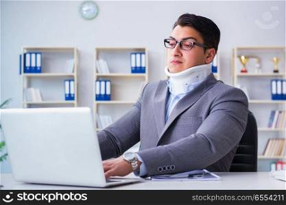 Businessman with neck injury working in the office