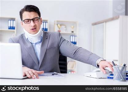 Businessman with neck injury working in the office