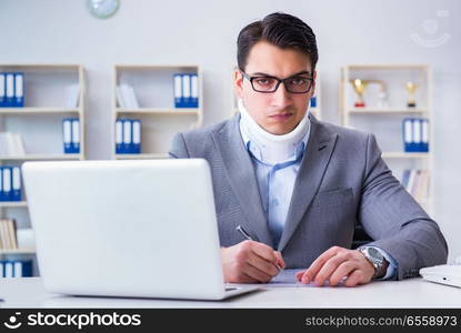 Businessman with neck injury working in the office