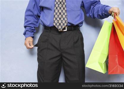 Businessman with no money left after shopping