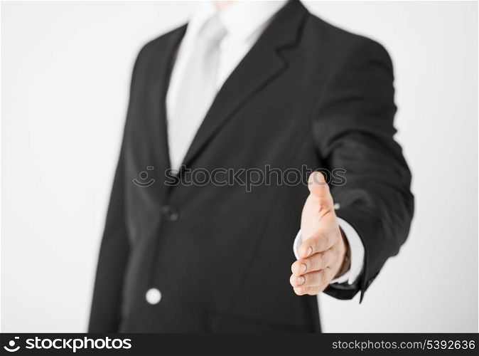 businessman with open hand ready for handshake