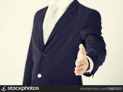 businessman with open hand ready for handshake