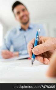 businessman with pen signing a contract