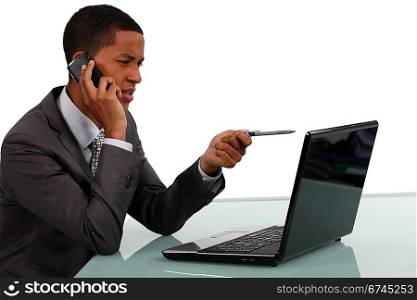 Businessman with phone and laptop