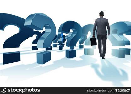 Businessman with question marks isolated on white