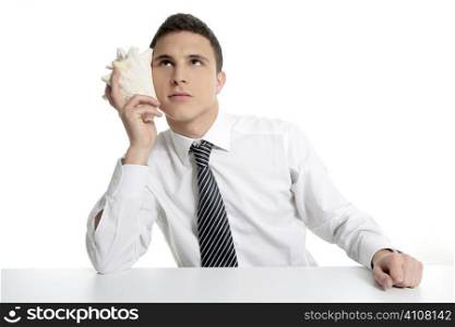 Businessman with sea shell isolated on white studio background