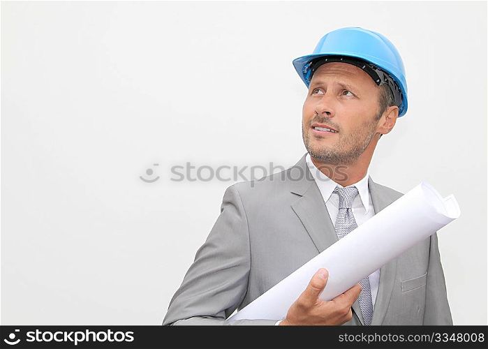 Businessman with security helmet on white background