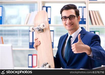 Businessman with skateboard in office