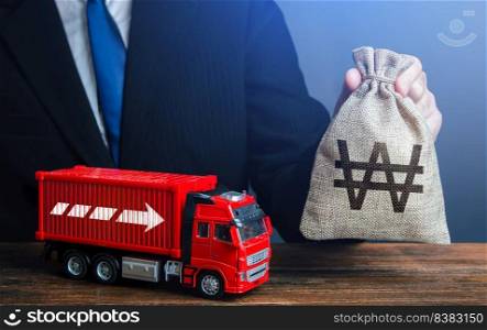 Businessman with south korean won money bag and truck. Good salaries for drivers. Rising prices, global containers shortage crisis. High income of the transport business and the transport of goods.