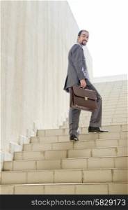 Businessman with stair in business concept