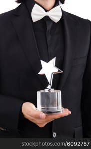 Businessman with star award isolated on white