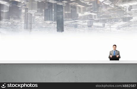 Businessman with suitcase. Young handsome businessman with briefcase in hands