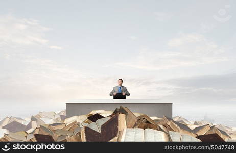 Businessman with suitcase. Young handsome businessman with briefcase in hands