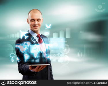 Businessman with tablet pc. Image of businessman with tablet pc against high-tech background