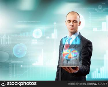 Businessman with tablet pc. Image of businessman with tablet pc against high-tech background