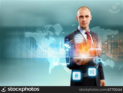 Businessman with tablet pc. Image of businessman with tablet pc against high-tech background
