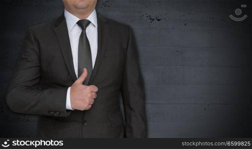 Businessman with thumbs up and copyspace.. Businessman with thumbs up and copyspace