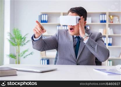 Businessman with virtual reality glasses in modern technology concept. Businessman with virtual reality glasses in modern technology co